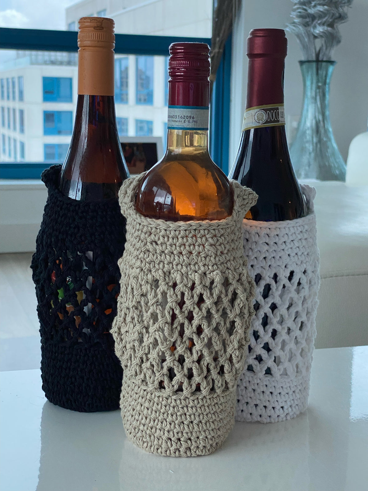 Pictured is our take on the classic "wine tote" in white, black, and beige.