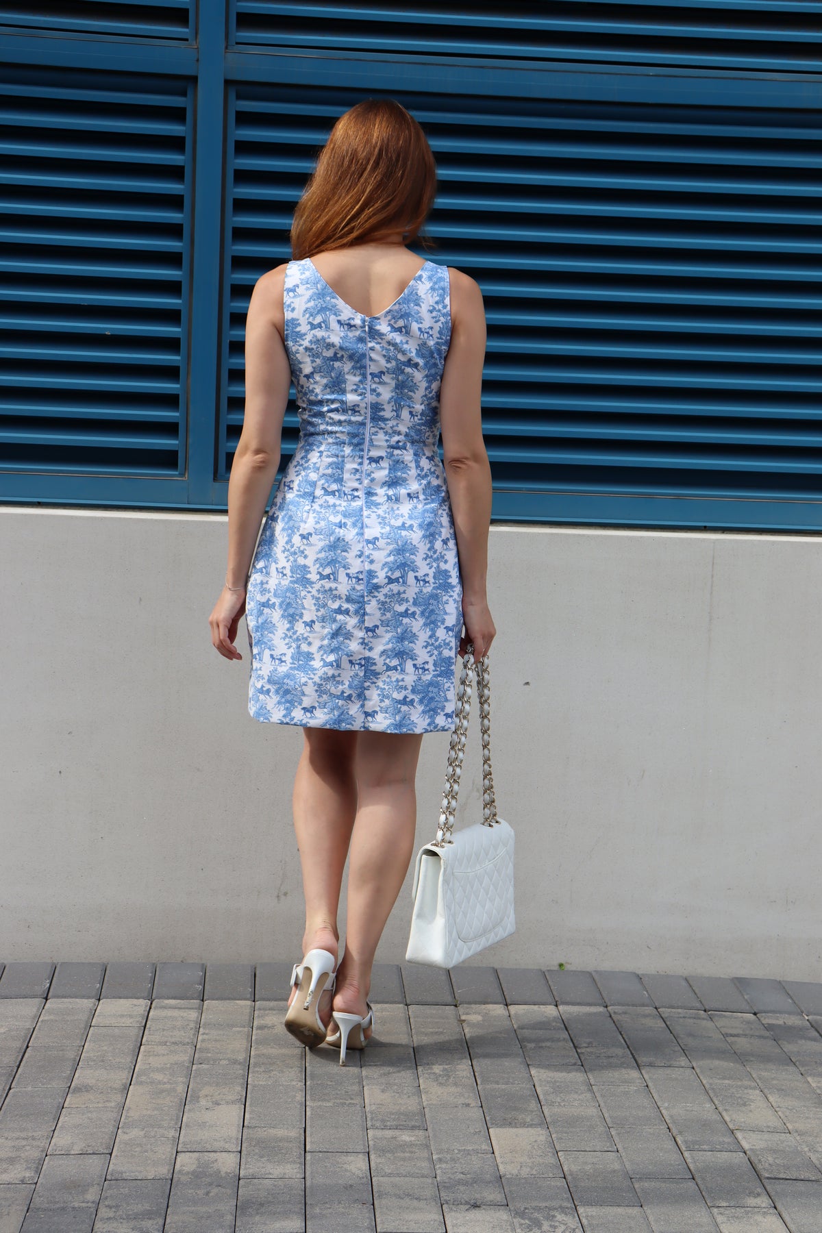 Back view of Short Blue Toile Sheath Dress printed with horses