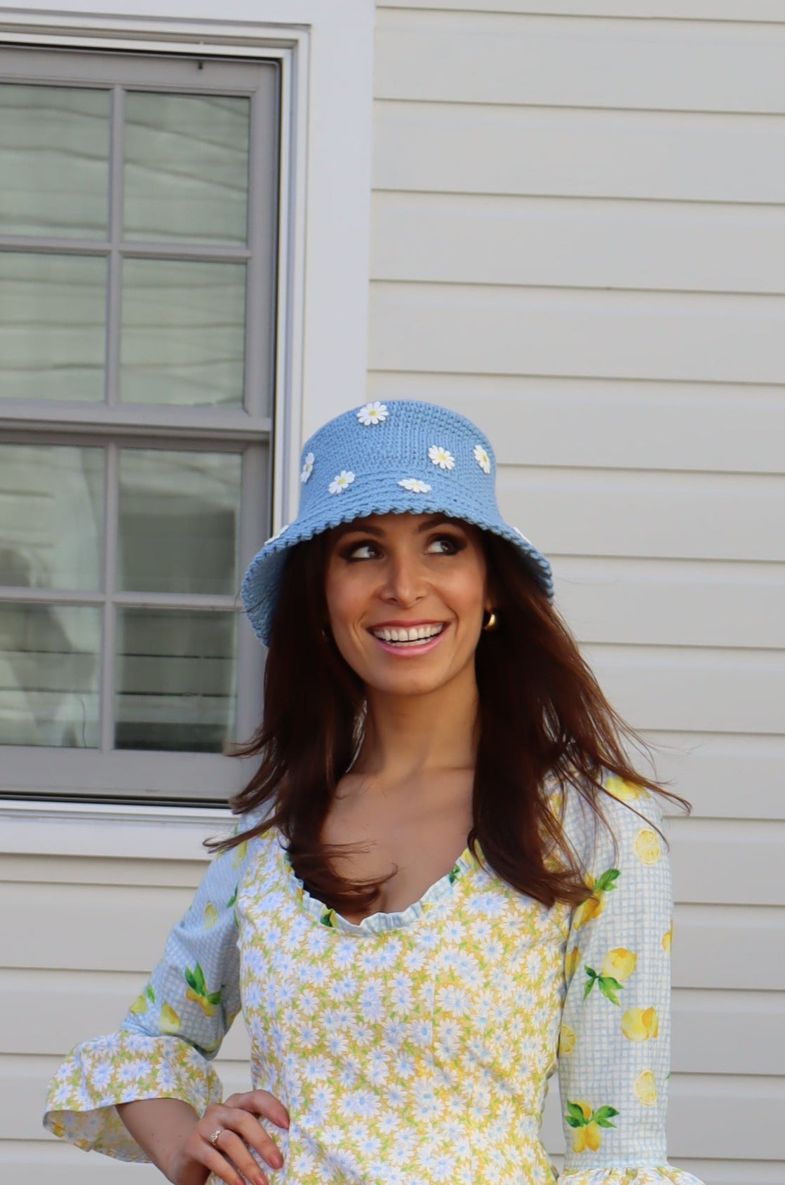 Model looking up wearing Hand Crocheted Bucket Hat with Daisies.